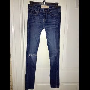 Super skinny dark wash jeans with rips in knees